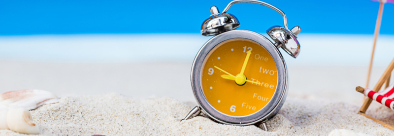 Clock on beach